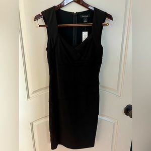 Brand new with tags this black cocktail dress by WHBM.